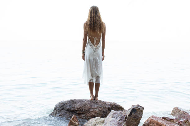 istock Beautiful young woman enjoying the beach 1210022212