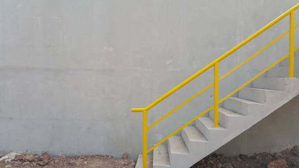 istock Walk way with yellow handrail inside factory 1210024792