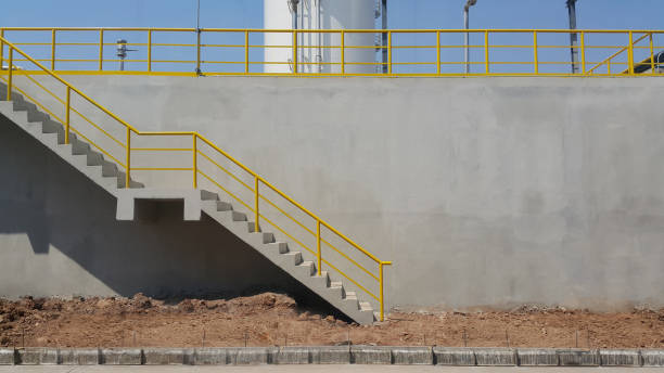 Walk way with yellow handrail inside factory