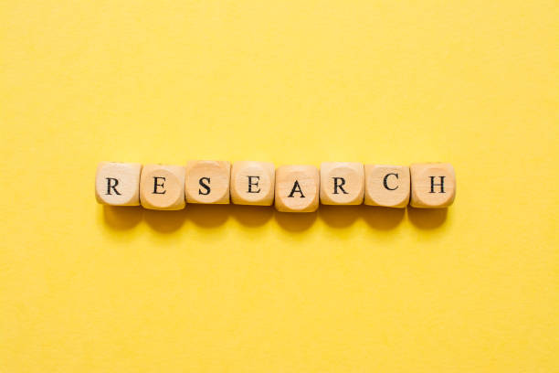 istock the word Research, text made with dice on yellow background 1210030279
