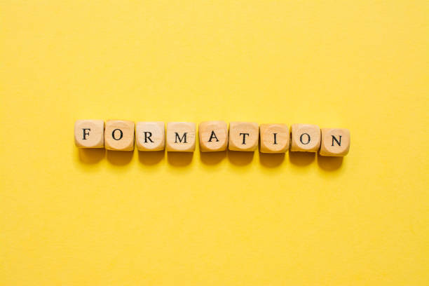 istock the word Formation, text made with dice on yellow background 1210031911