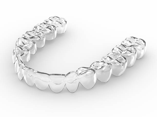 3d render of invisalign removable retainer 3d render of invisalign removable and invisible retainer over white background braces stock pictures, royalty-free photos & images