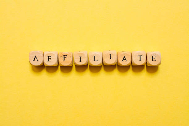 istock the word Affiliate, text made with dice on yellow background 1210033169