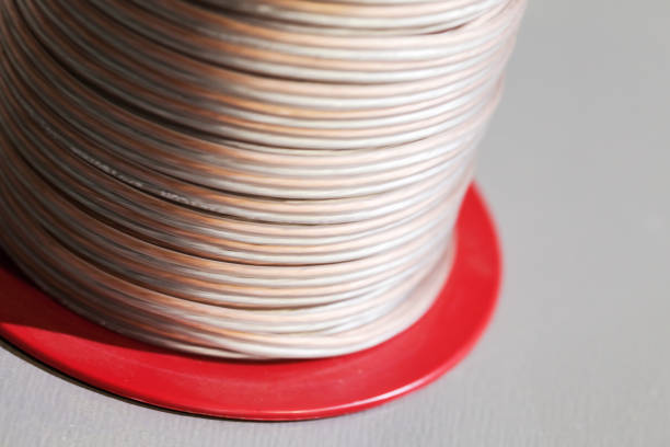 Cable reel with speaker wire close up photo. It is used to make the electrical connection between loudspeakers and audio amplifiers