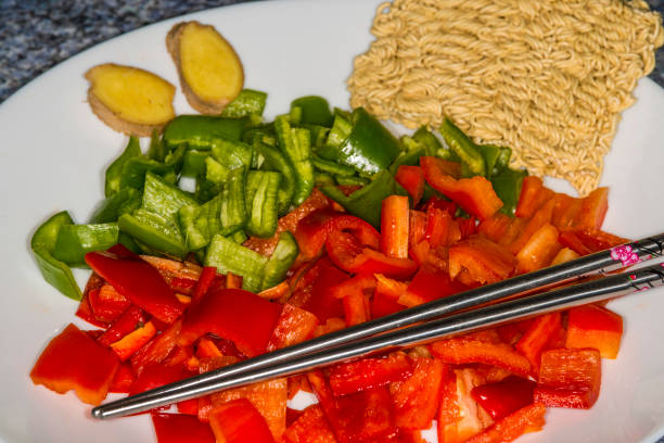 istock red and green cut peppers, ready for roasting 1210036001