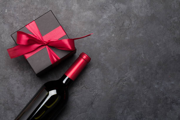 istock Valentines day card with wine and gift box 1210037200