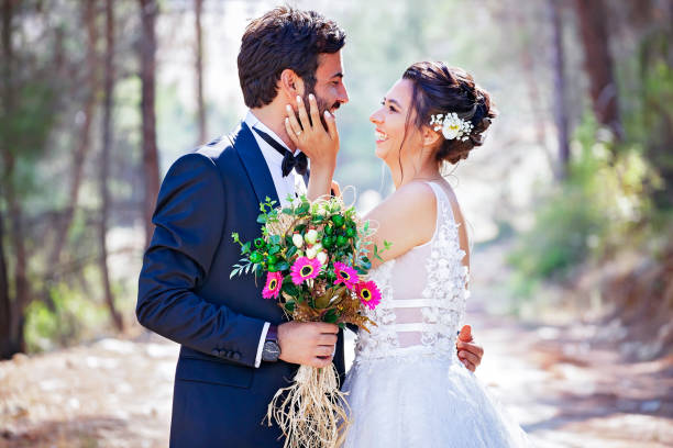 istock The bride and groom posing in nature. 1210038800
