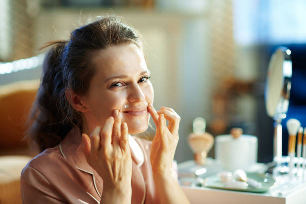 istock happy modern woman applying lip contour cream 1210038850
