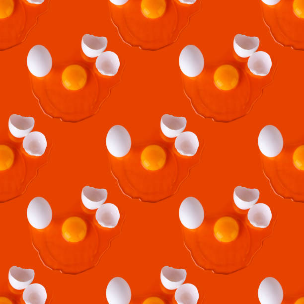 istock Seamless pattern of white broken eggs on orange background, repeating ornament raw egg with yellow yolk on red backdrop, art Easter banner, creative paschal poster, food wallpaper, trendy print design 1210039250
