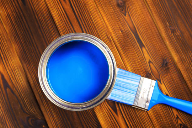 istock House renovation, paint can on the old wooden background with copy space 1210041677