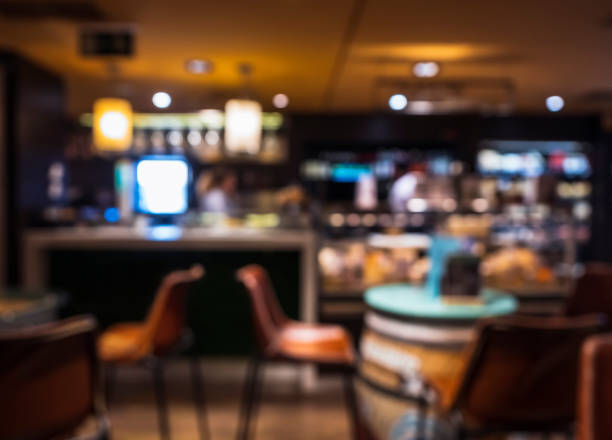 istock Blur Bar Nightclub Interior Table and seats with people drinking Nightlife 1210041683