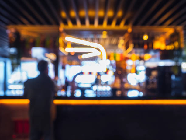 istock Silhouette people standing at Bar counter Blur background 1210041685