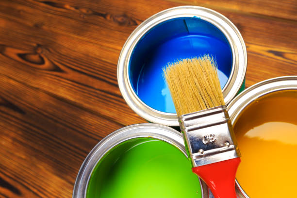 istock House renovation, paint cans on the old wooden background with copy space 1210041740