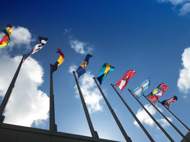 istock Close up group of colorful various countries flags at flagpoles 1210041763