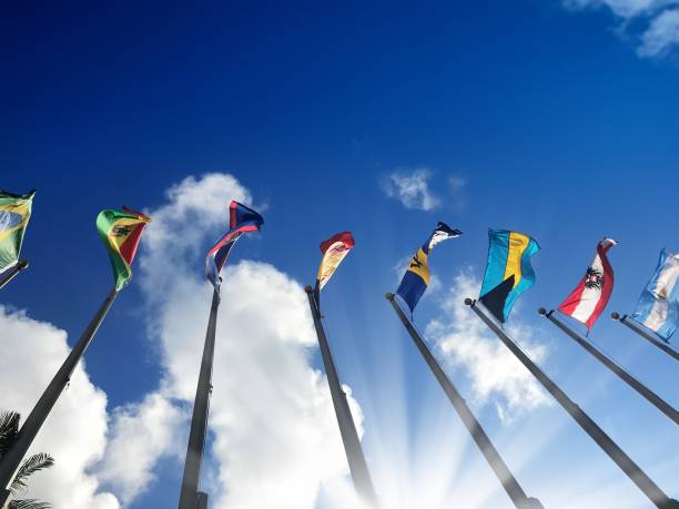 istock Close up group of colorful various countries flags at flagpoles 1210041783