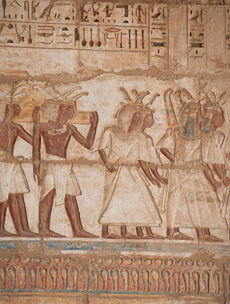 istock Egyptian hieroglyphics on a temple wall 121004236