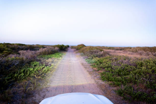 Dirty Rural Road And Car In Countryside.