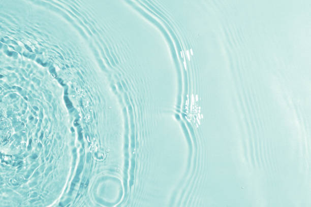 istock texture of splashing clean water on blue background 1210043437