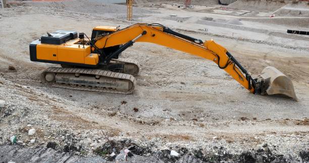 istock Excavator digs the foundation for a new building. 1210043606