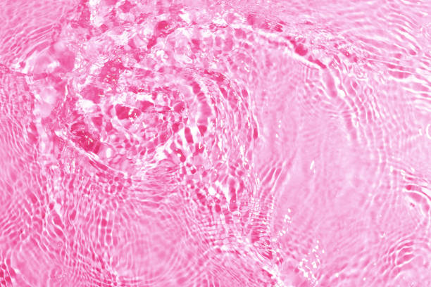 istock texture of splashing clean water on pink background 1210043699