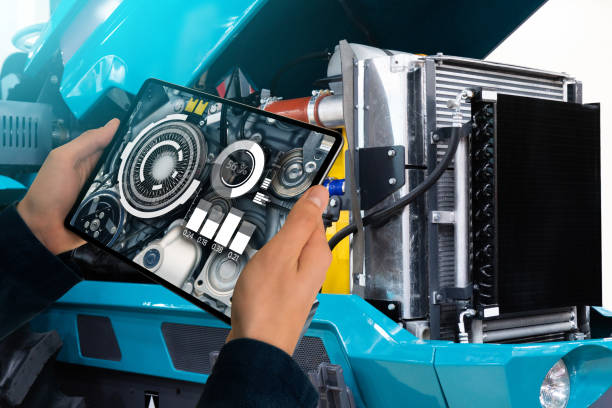 istock Serviceman repairing a tractor 1210044602