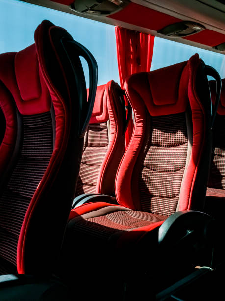 istock Closeup of red comfortable seats inside tourist bus 1210044707