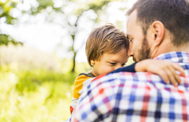 istock Happy boy and his single father enjoying in nature. 1210045564
