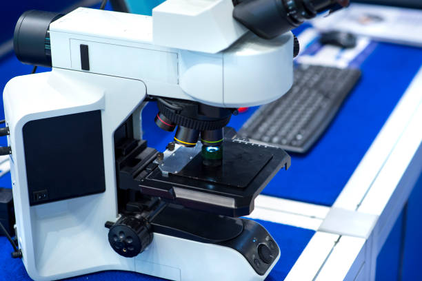 istock Close-up shot of microscope with metal lens at laboratory. 1210046020