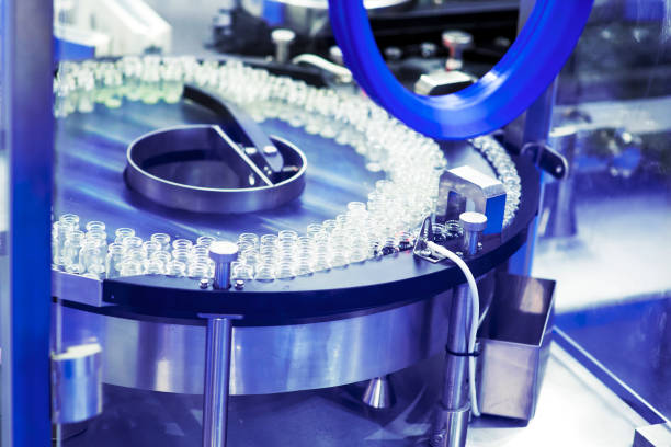 istock pharmaceutical industry. Production line machine conveyor at factory with bottles 1210046130
