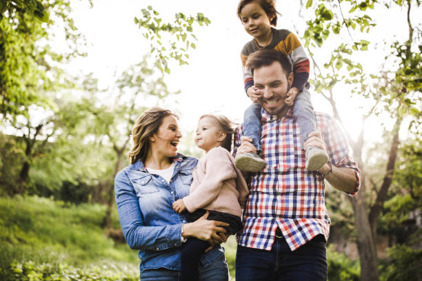 istock Happy parents having fun with their kids in nature. 1210047848