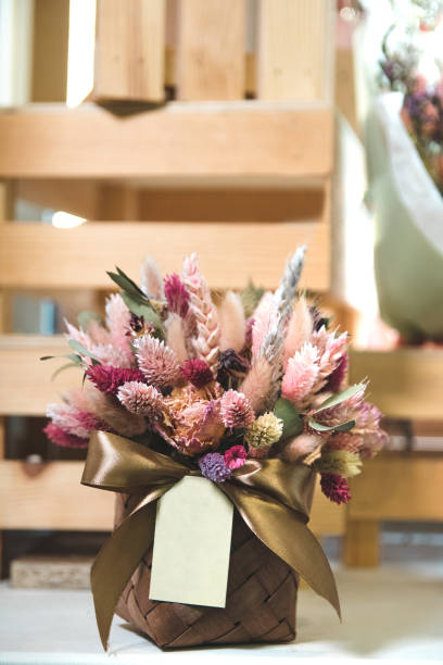istock Dry flowers in basket with blank label. 1210049038
