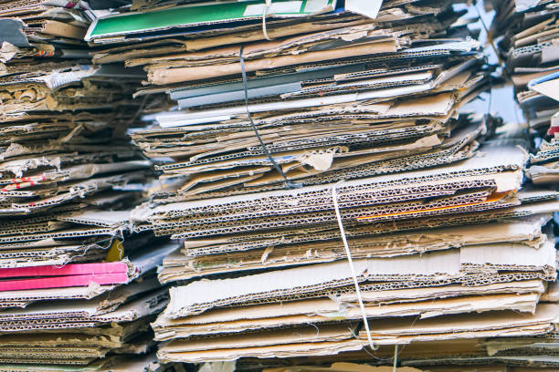 istock Bales of cardboard and box board with strapping wire ties 1210049648