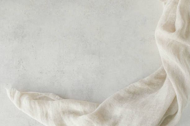 istock Pure washed linen cloth on light grunge stone background. 1210051916