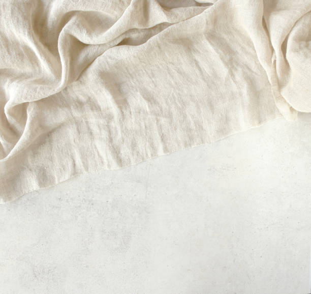 istock Pure washed linen cloth on light grunge stone background. 1210051945