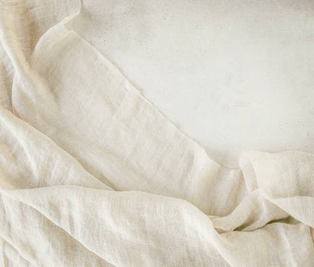 istock Pure washed linen cloth on light grunge stone background. 1210051964