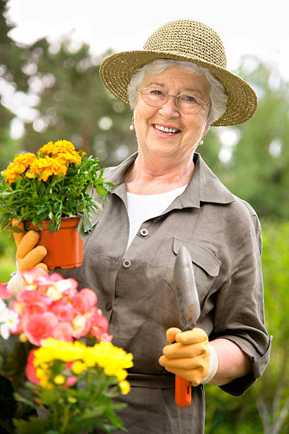istock Senior woman gardening 121005382