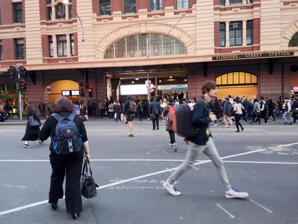Crowd walking at Flinders Street railway station, Melbourne, Australia Crowd of people walking at Flinders Street railway station in Melbourne, Victoria. 
It is the busiest station on Melbourne's metropolitan network. The main station building, completed in 1909, is a cultural icon of Melbourne. It is listed on the Victorian Heritage Register. melbourne street crowd stock pictures, royalty-free photos & images