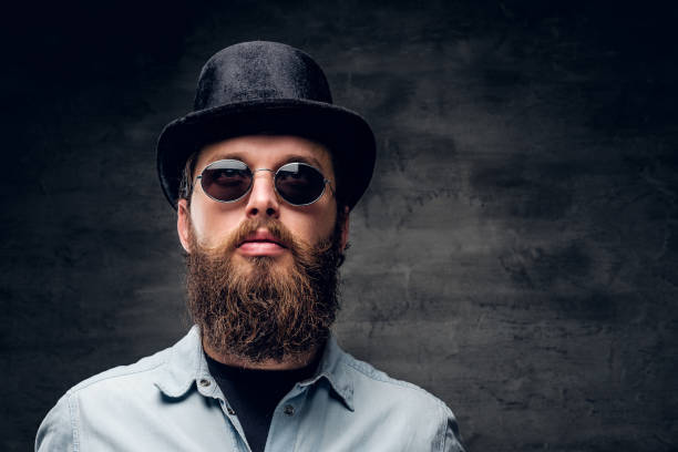 istock Groomed man at dark photo studio 1210059110