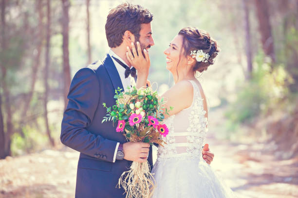 istock The bride and groom posing in nature. 1210059425