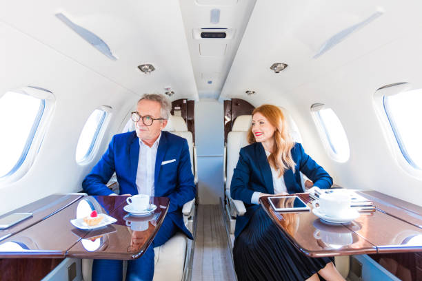 istock Business people traveling by corporate jet 1210059861