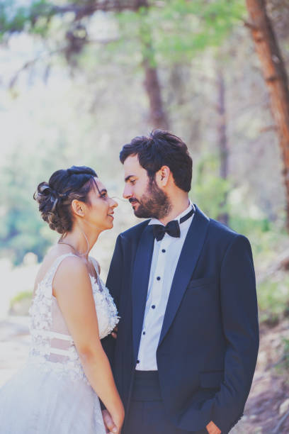 istock The bride and groom posing in nature. 1210067220