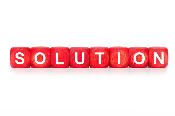 istock term SOLUTION - built from red wooden cubes on white background, isolated 1210067283