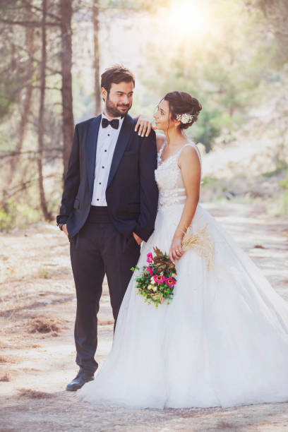 istock The bride and groom posing in nature. 1210068684