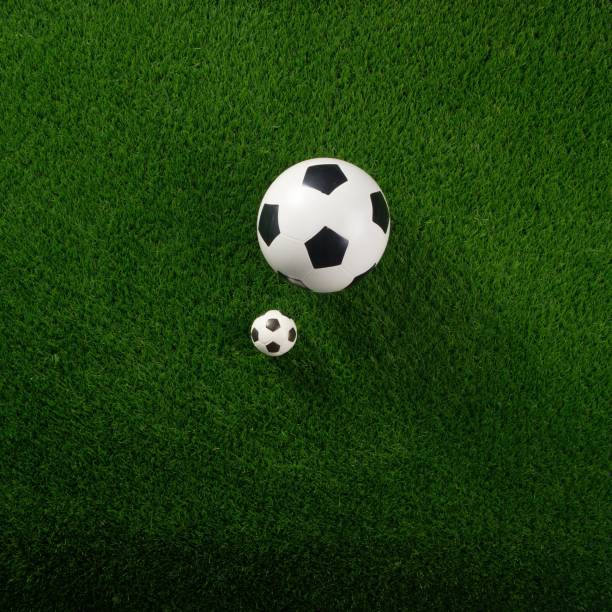 istock Soccer balls on the green grass. Concept World Cup. Flat lay. Copy space.Square 1210068694