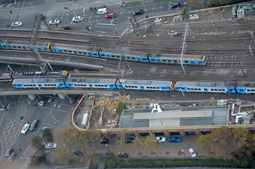 High angle view of Metro trains riding at Flinders station in Melbourne CBD, Victoria.