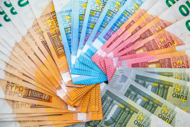 istock 50, 20, 10 and 5 euro bills on a white background 1210073271