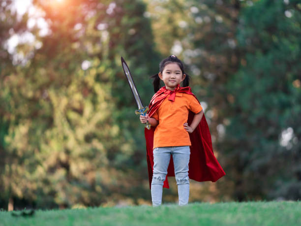 istock Wonder Girl Holding a Sword 1210074690