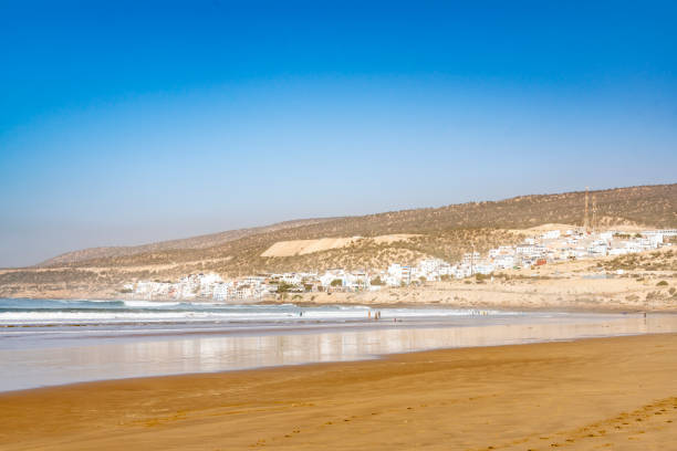 The Sea at Taghazout, Morocco Atlantic Ocean at Taghazout, a tourist area in Morocco that is receiving considerable investment in new hotels, apartments etc. sunset agadir marocco stock pictures, royalty-free photos & images