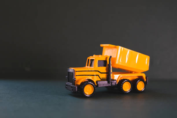 istock Closeup group yellow truck vehicle 1210074911