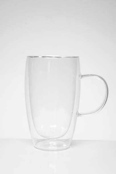 istock empty tea or coffee mug made of double transparent glass 1210078049
